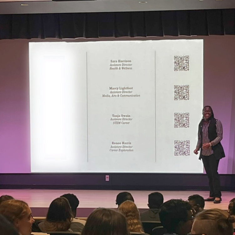 On stage sharing QR-code resources for each campus career team’s specialty area, from health and wellness to STEM.