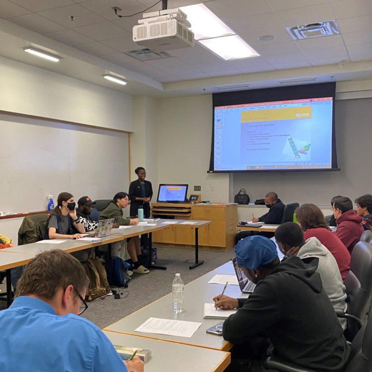 Facilitating a small-group career workshop with students.